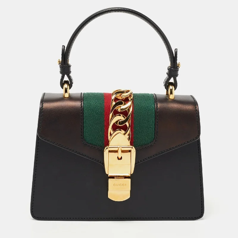 Women Gucci Sylvie bags with a leather - wrapped handleGucci Black Leather Mini Web Chain Sylvie Top Handle Bag