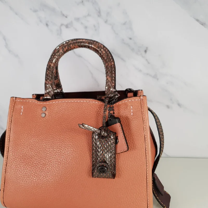 Coach bags with a front - zip pocket for small items like keys and cardsCoach 1941 Rogue 25 in Melon with Snakeskin Handles - Shoulder Bag Handbag in Pebble Leather Pink Salmon Peach