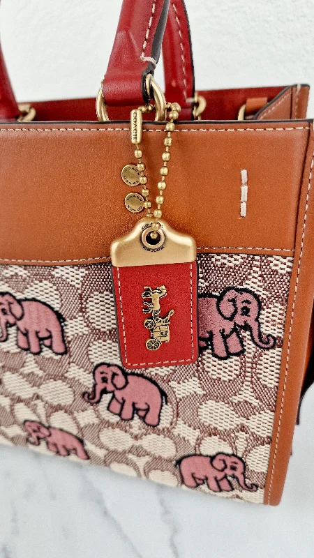 Coach Rogue bags with a detachable shoulder strap for versatile carryingCoach Rogue 25 Signature Textile Jacquard with Embroidered Pink Elephants 1941 Handbag - Coach C6165