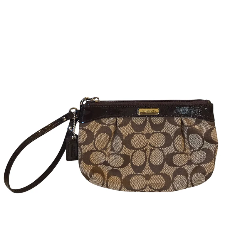 Coach Dempsey bags with a leather - wrapped drawstring for a luxurious feelWristlet Designer By Coach In Brown, Size:Medium