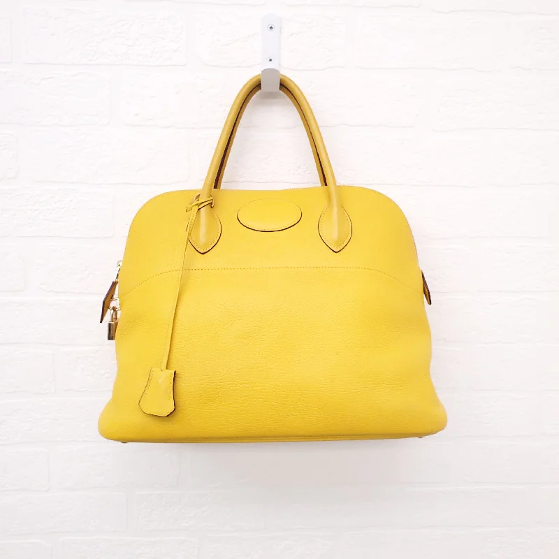 Hermes Bags with Hidden Pocket Compartments for PrivacyHERMÈS YELLOW BOLIDE BAG