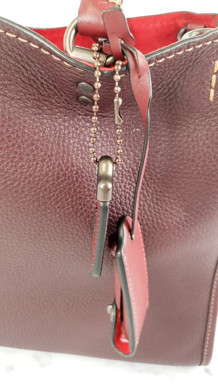 Coach bags with a front - zip pocket for small items like keys and cardsCoach 1941 Rogue 31 in Oxblood Pebble Leather Red Suede Lining Satchel Handbag - Coach 38124