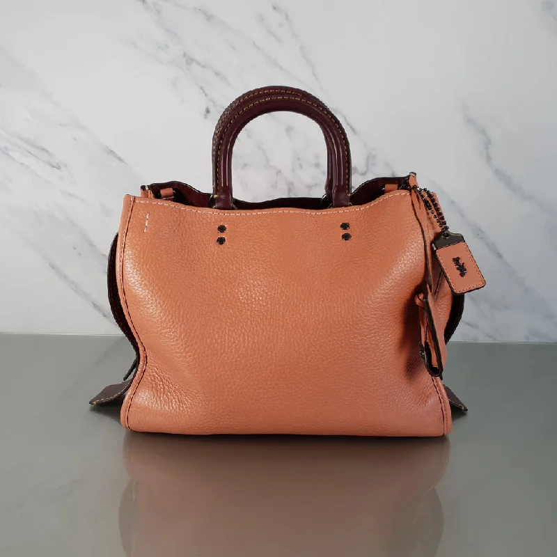 Coach bags with a front - flap pocket and a turnlock for a classic aestheticCoach 1941 Rogue 31 in Melon with Burgundy Colorblock Detail and Suede - Satchel Bag