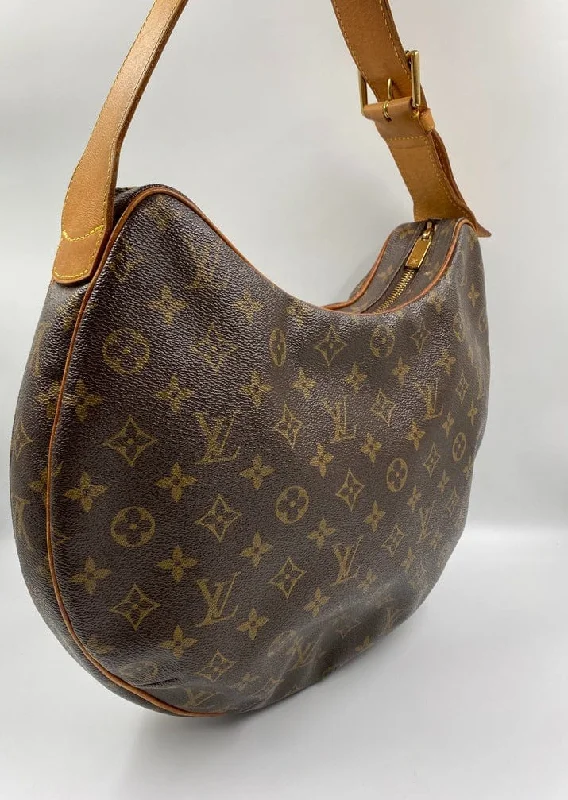 Louis Vuitton bags with a snap - button closure and a decorative charm for styleLouis Vuitton Croissant GM