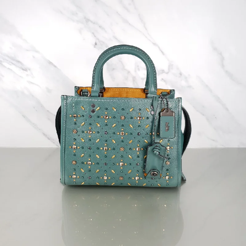 Coach bags with a front - flap pocket and a turnlock for a classic aestheticCoach 1941 Rogue 25 in Dark Turquoise With Prairie Rivets Satchel 21590