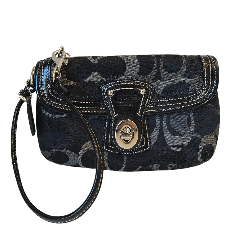 Coach handbags with a perforated leather detail for a breathable and unique designWristlet Designer By Coach In Black, Size:Medium