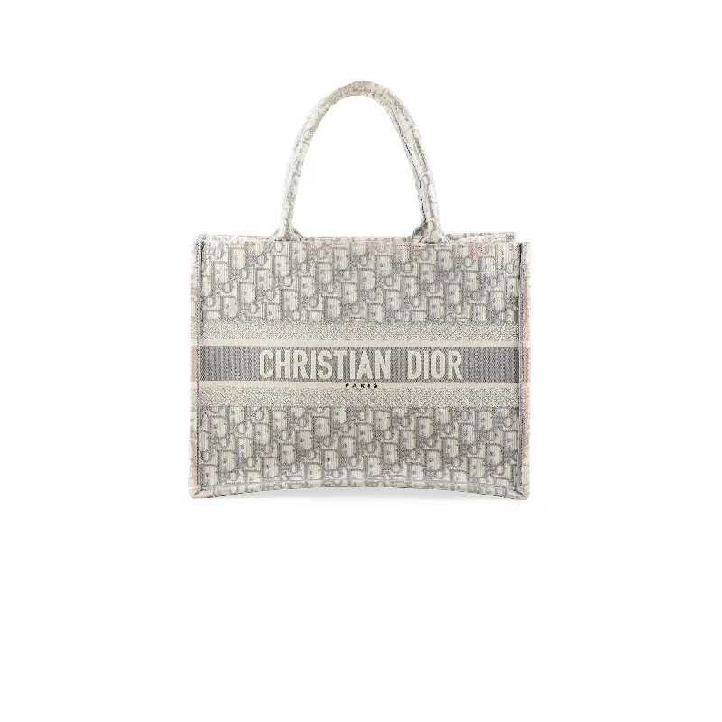 Christian Dior Saddle bags with a studded trim for a bold lookChristian Dior Medium Book Tote Oblique Grey