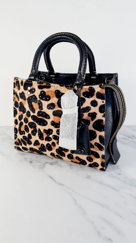 Coach Borough bags with a structured silhouette and a magnetic - snap closureCoach 1941 Rogue 25 Wild Beast Leopard in Black With Haircalf and Rivets - Satchel Handbag Coach 32872