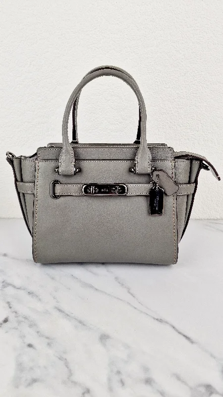 Coach Borough bags with a structured silhouette and a magnetic - snap closureCoach Swagger 21 in Grey Smooth Leather - Handbag Crossbody Bag - Coach 22719